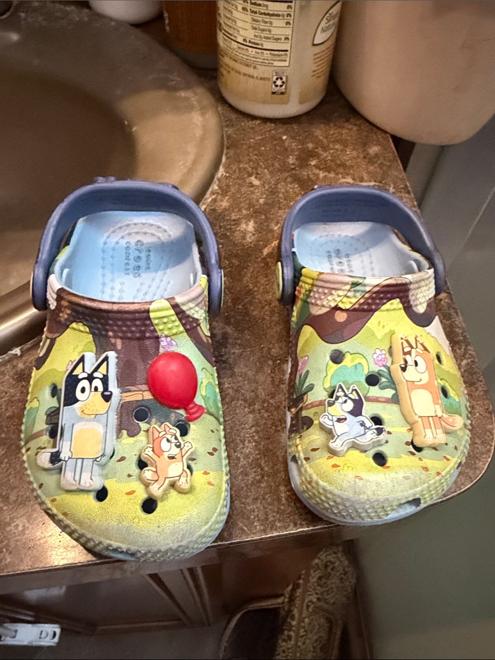 CROCS Kids Green and Blue Character Clog Sandals with Balloon Accent